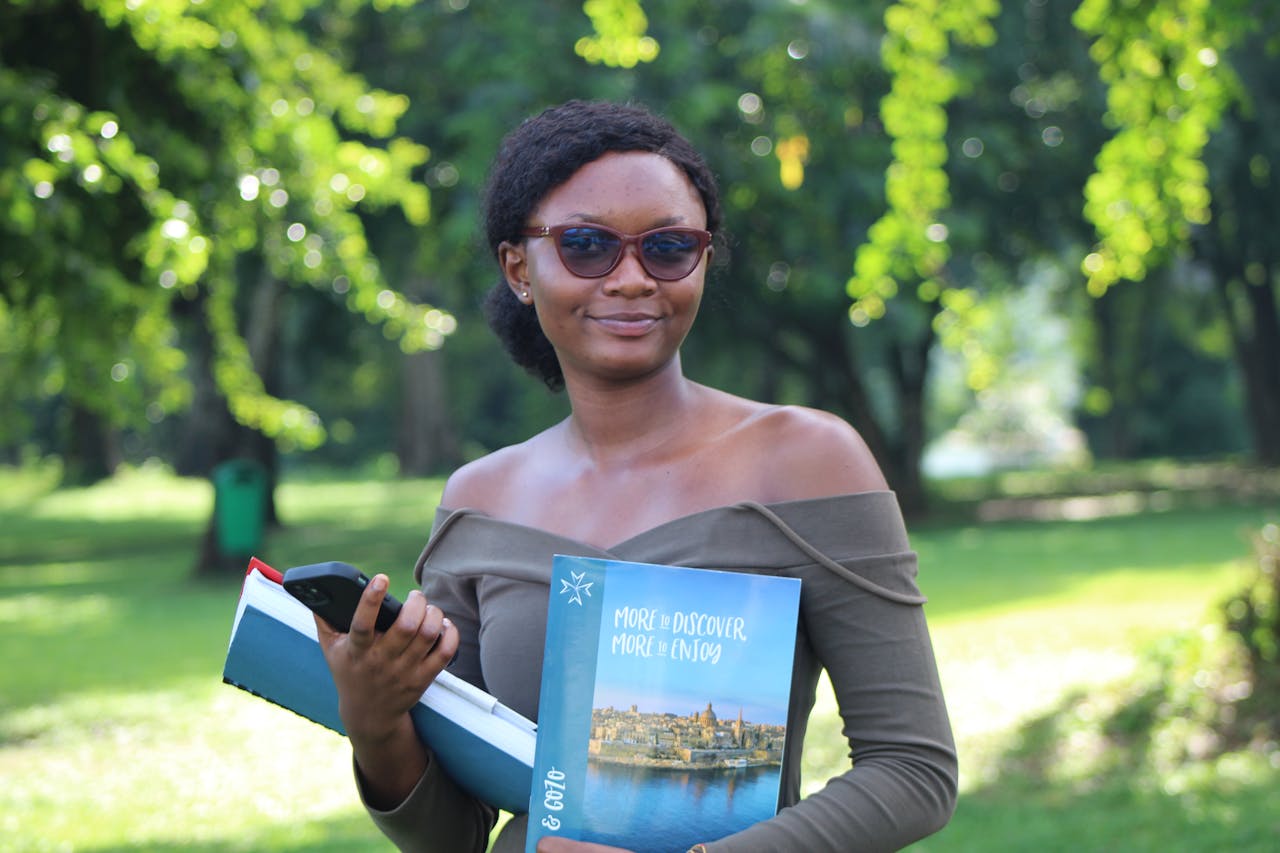 Smiling student with books